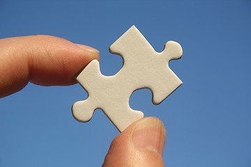 Image showing Jigsaw Puzzle in Human Fingers