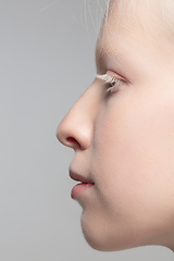 Image showing Close up portrait of beautiful albino woman isolated on studio background. Beauty, fashion, skincare, cosmetics concept. Details.