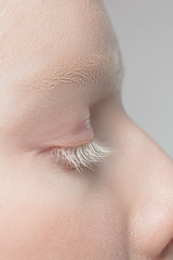 Image showing Close up portrait of beautiful albino woman isolated on studio background. Beauty, fashion, skincare, cosmetics concept. Details.