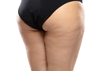 Image showing Overweight woman with fat cellulite legs and buttocks, obesity female body in black underwear isolated on white background