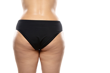 Image showing Overweight woman with fat cellulite legs and buttocks, obesity female body in black underwear isolated on white background