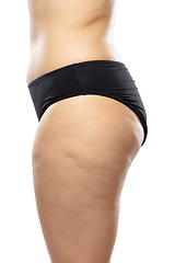 Image showing Overweight woman with fat cellulite legs and buttocks, obesity female body in black underwear isolated on white background