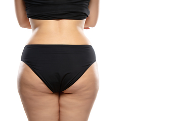 Image showing Overweight woman with fat cellulite legs and buttocks, obesity female body in black underwear isolated on white background