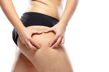 Image showing Overweight woman with fat cellulite legs and buttocks, obesity female body in black underwear isolated on white background