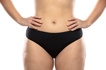 Image showing Overweight woman with fat cellulite legs and buttocks, obesity female body in black underwear isolated on white background