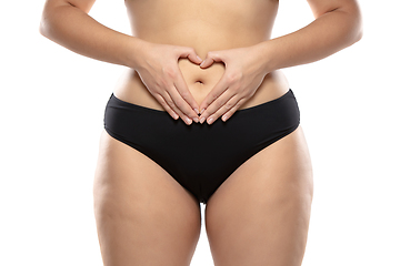 Image showing Overweight woman with fat cellulite legs and buttocks, obesity female body in black underwear isolated on white background