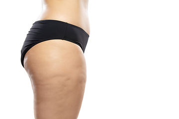 Image showing Overweight woman with fat cellulite legs and buttocks, obesity female body in black underwear isolated on white background