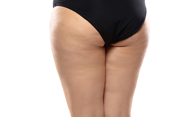 Image showing Overweight woman with fat cellulite legs and buttocks, obesity female body in black underwear isolated on white background