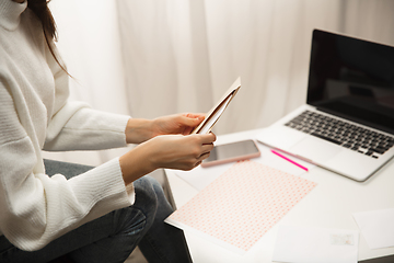 Image showing Woman opening, recieving greeting card for New Year and Christmas 2021 from friends or family