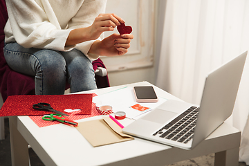 Image showing Woman making greeting card for New Year and Christmas 2021 for friends or family, scrap booking, DIY