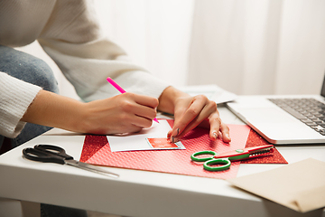 Image showing Woman making greeting card for New Year and Christmas 2021 for friends or family, scrap booking, DIY