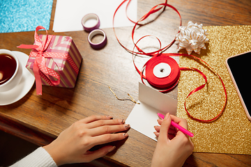 Image showing Woman making greeting card for New Year and Christmas 2021 for friends or family, scrap booking, DIY