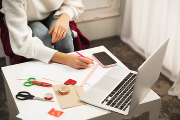 Image showing Woman making greeting card for New Year and Christmas 2021 for friends or family, scrap booking, DIY