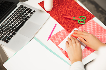 Image showing Woman making greeting card for New Year and Christmas 2021 for friends or family, scrap booking, DIY