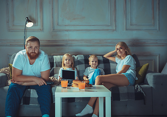 Image showing Mother, father and kids at home having fun, comfort and cozy concept