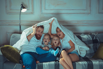 Image showing Mother, father and kids at home having fun, comfort and cozy concept