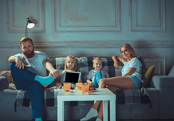 Image showing Mother, father and kids at home having fun, comfort and cozy concept