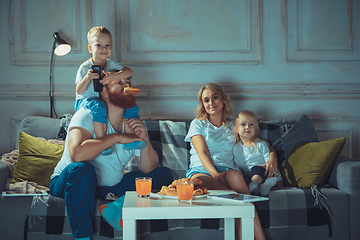 Image showing Mother, father and kids at home having fun, comfort and cozy concept