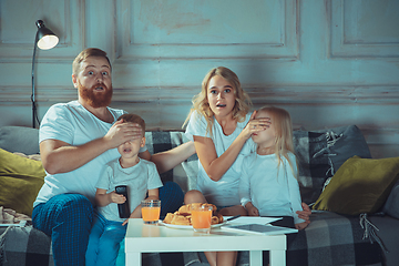 Image showing Mother, father and kids at home having fun, comfort and cozy concept