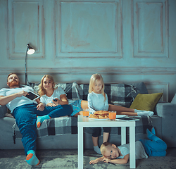 Image showing Mother, father and kids at home having fun, comfort and cozy concept