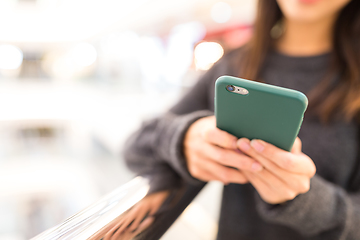 Image showing Woman sending sms on mobile phone