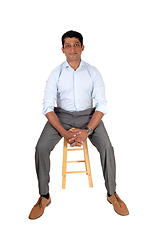 Image showing Handsome Asian man sitting on chair