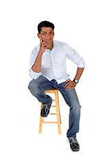 Image showing Full length image of Asian man sitting