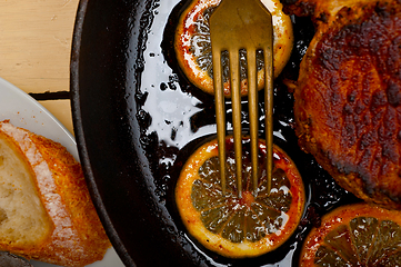 Image showing pork chop seared on iron skillet