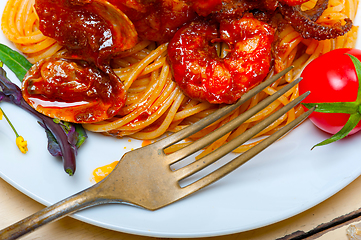 Image showing Italian seafood spaghetti pasta on red tomato sauce