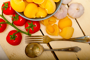 Image showing Italian snail lumaconi pasta with tomatoes