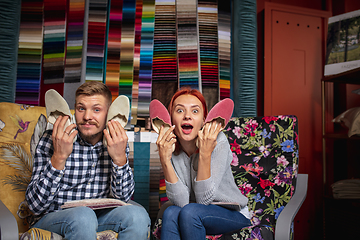 Image showing Couple choosing textile at home decoration store, shop. Making of home interior design during quarantine