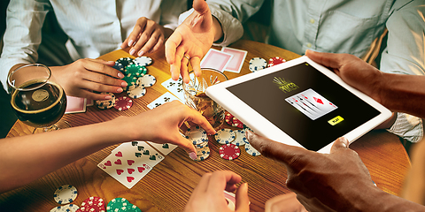 Image showing Online gambling, casino concept. Hand holding device with lottery, casino cover