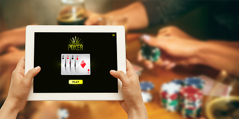 Image showing Online gambling, casino concept. Hand holding device with lottery, casino cover