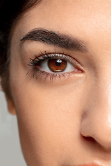 Image showing Close up portrait of beautiful jewish woman isolated on studio background. Beauty, fashion, skincare, cosmetics concept. Details.