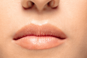 Image showing Close up portrait of beautiful jewish woman isolated on studio background. Beauty, fashion, skincare, cosmetics concept. Details.