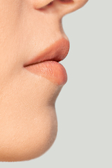 Image showing Close up portrait of beautiful jewish woman isolated on studio background. Beauty, fashion, skincare, cosmetics concept. Details.