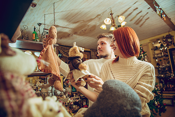 Image showing Smiling family, couple looking for home decoration and holiday\'s gifts in household store