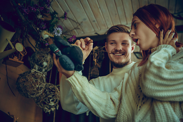 Image showing Smiling family, couple looking for home decoration and holiday\'s gifts in household store