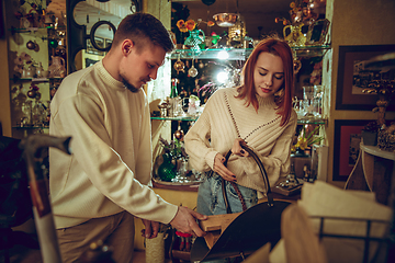 Image showing Smiling family, couple looking for home decoration and holiday\'s gifts in household store