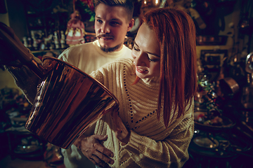 Image showing Smiling family, couple looking for home decoration and holiday\'s gifts in household store