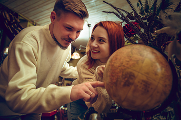 Image showing Smiling family, couple looking for home decoration and holiday\'s gifts in household store