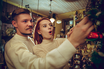 Image showing Smiling family, couple looking for home decoration and holiday\'s gifts in household store