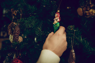 Image showing Close up hands of woman looking for home decoration and holiday\'s gifts in household store