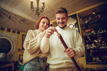 Image showing Smiling family, couple looking for home decoration and holiday\'s gifts in household store