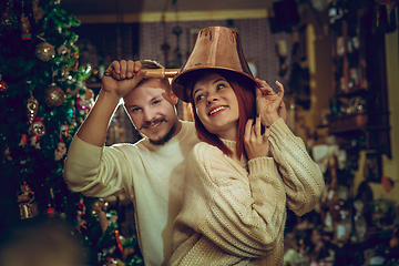 Image showing Smiling family, couple looking for home decoration and holiday\'s gifts in household store