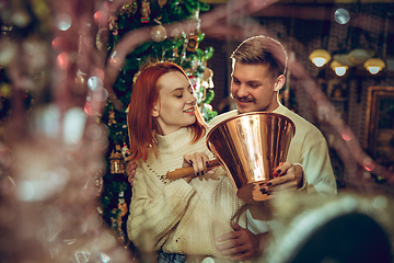 Image showing Smiling family, couple looking for home decoration and holiday\'s gifts in household store