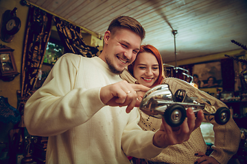 Image showing Smiling family, couple looking for home decoration and holiday\'s gifts in household store