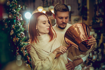 Image showing Smiling family, couple looking for home decoration and holiday\'s gifts in household store