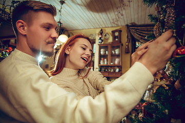 Image showing Smiling family, couple looking for home decoration and holiday\'s gifts in household store