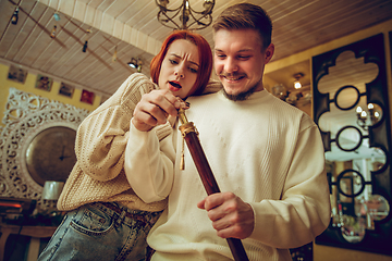 Image showing Smiling family, couple looking for home decoration and holiday\'s gifts in household store